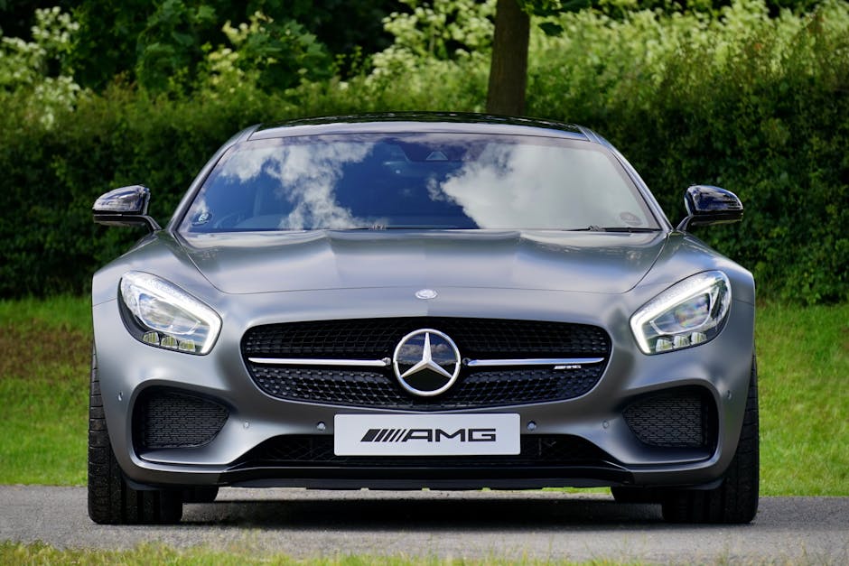 Front view of a luxury Mercedes-Benz AMG against a natural backdrop